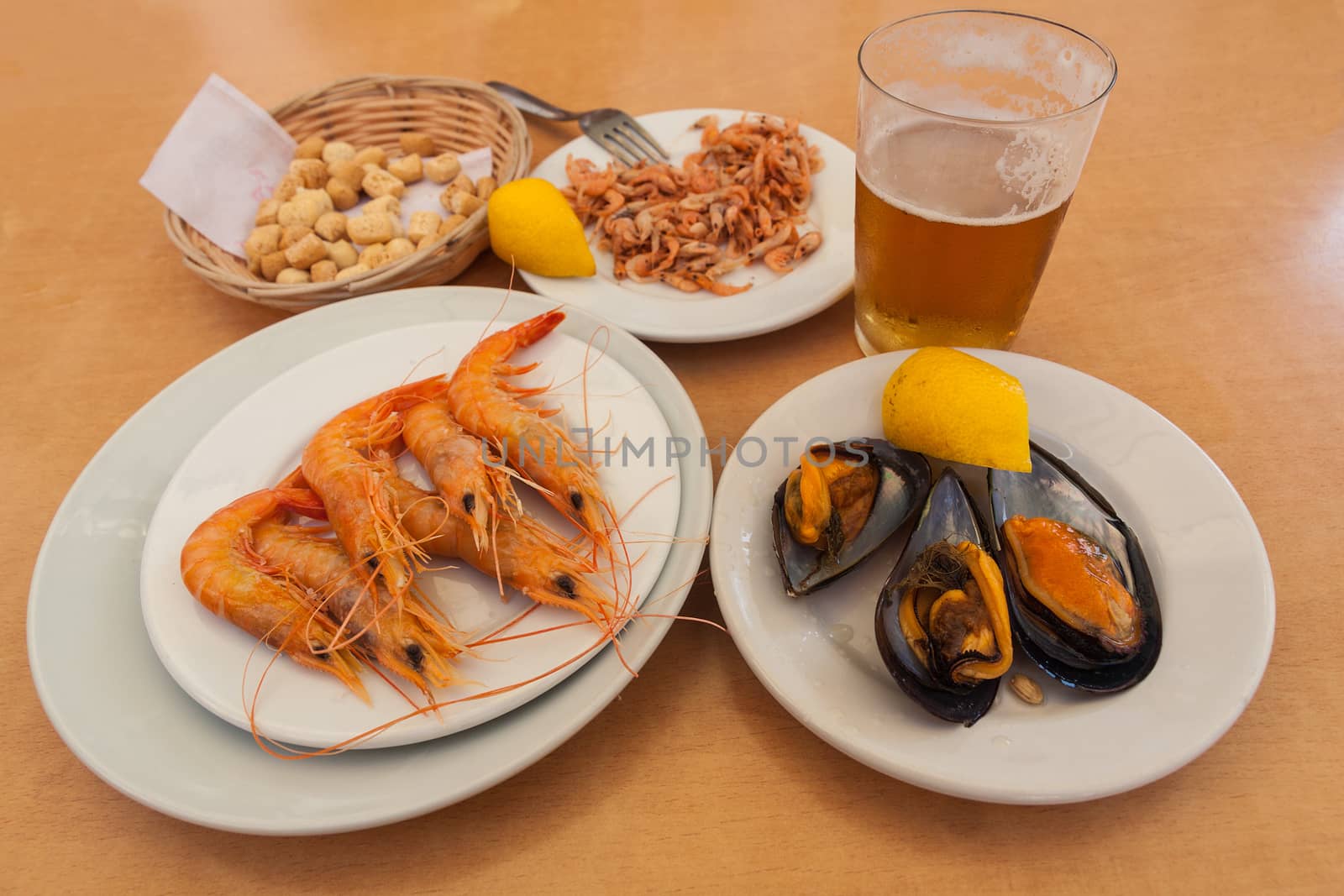 Mussels, shrimps and croutons with glass of beer