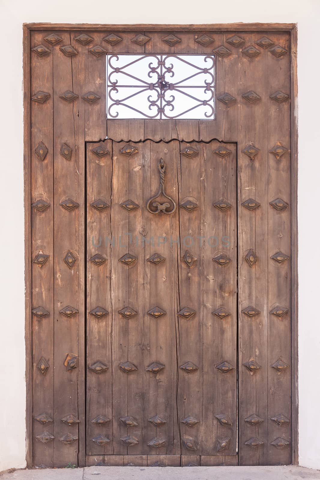 Old wooden door with metal knocker