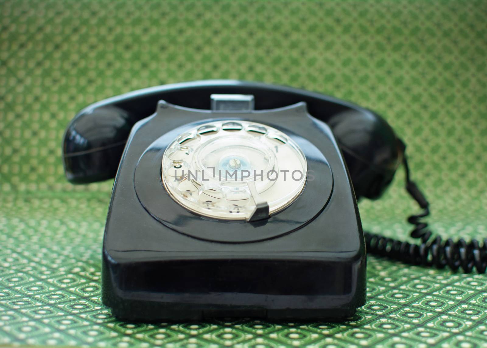 Old black vintage telephone close up