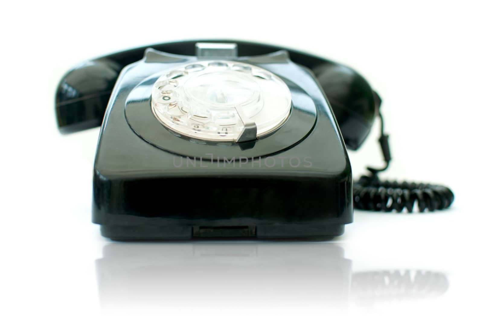 Vintage telephone over a white background