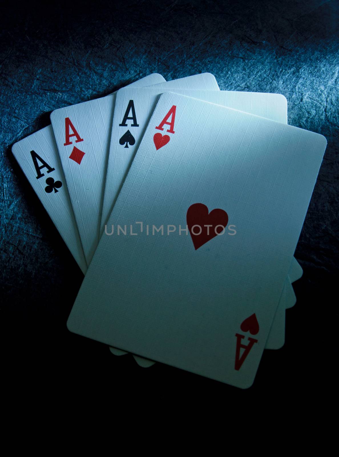 Set of winning playing cards including four aces 