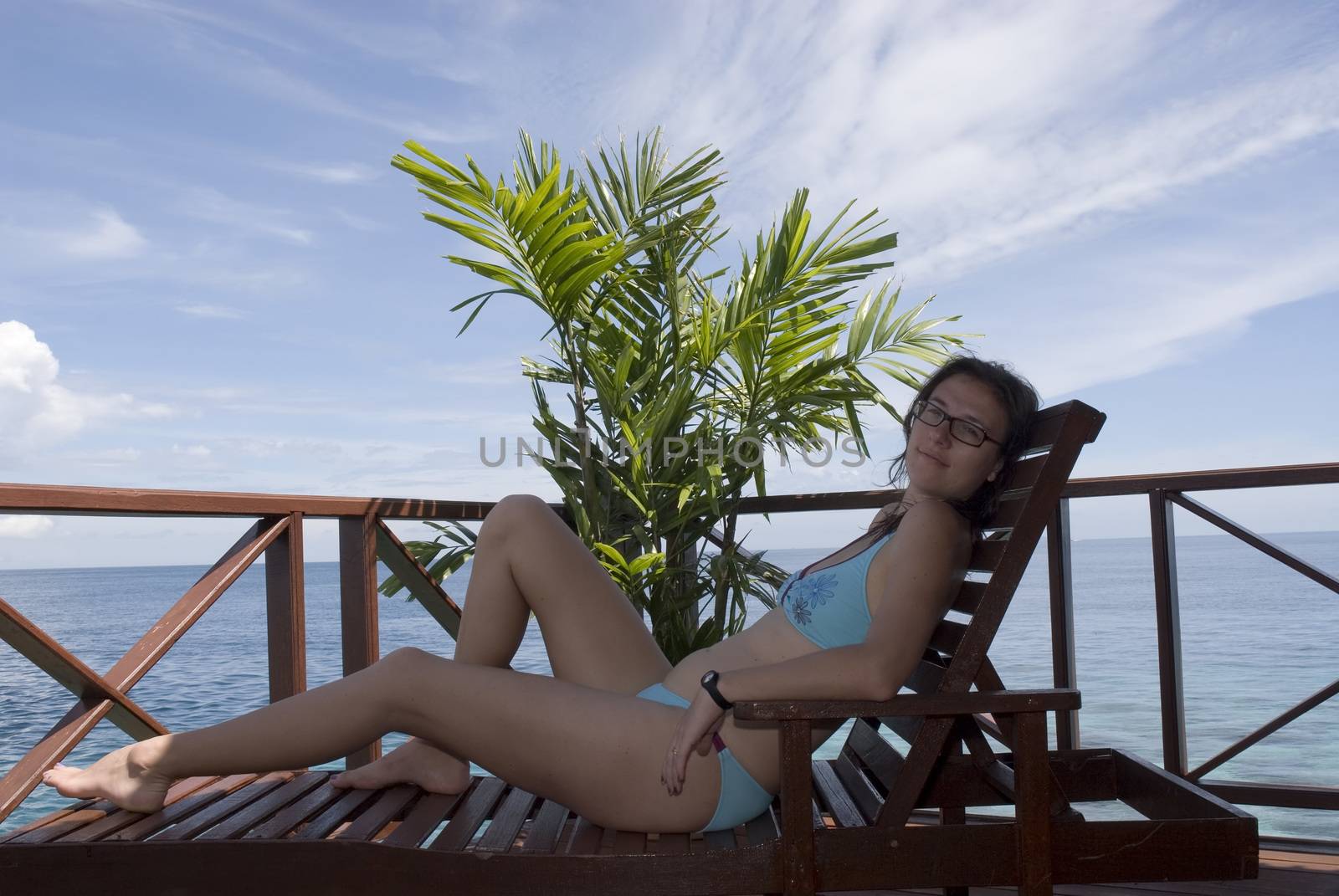 An attractive woman enjoying the sun shine in the tropics