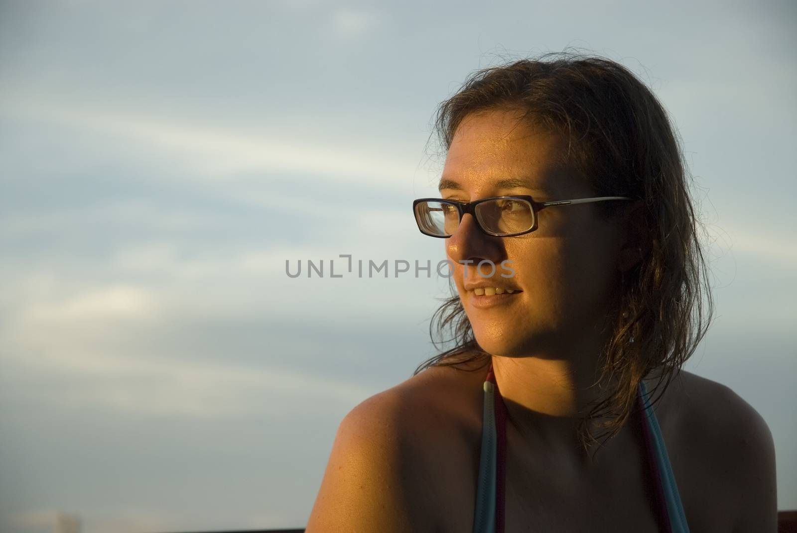 An attractive woman enjoying the sun shine in the tropics