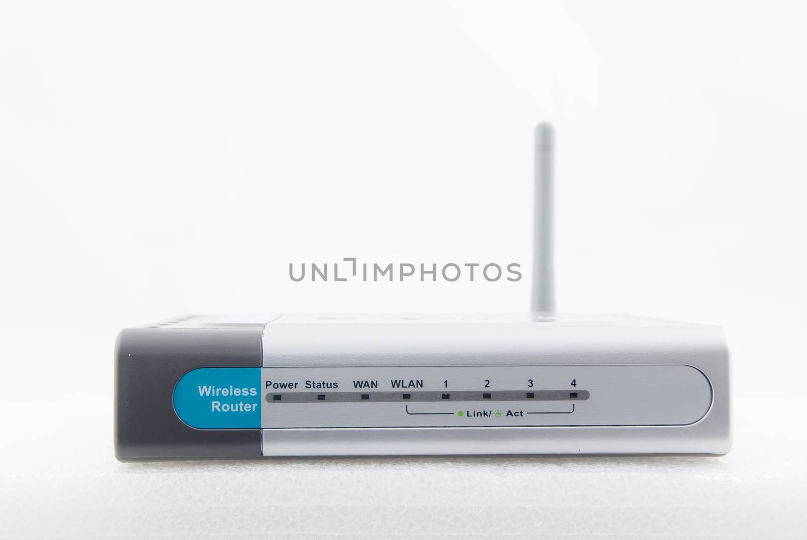 A modern wireless router shot from the front