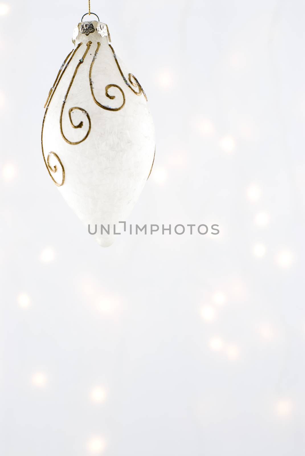 Christmas Decorations against a background lit with christmas lights