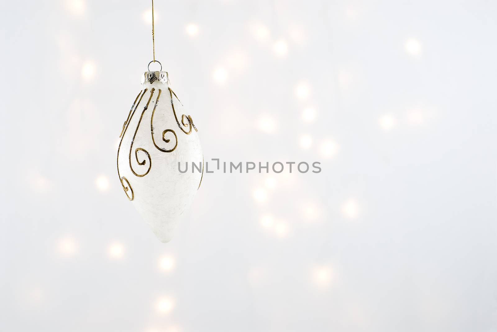 Christmas Decorations against a background lit with christmas lights