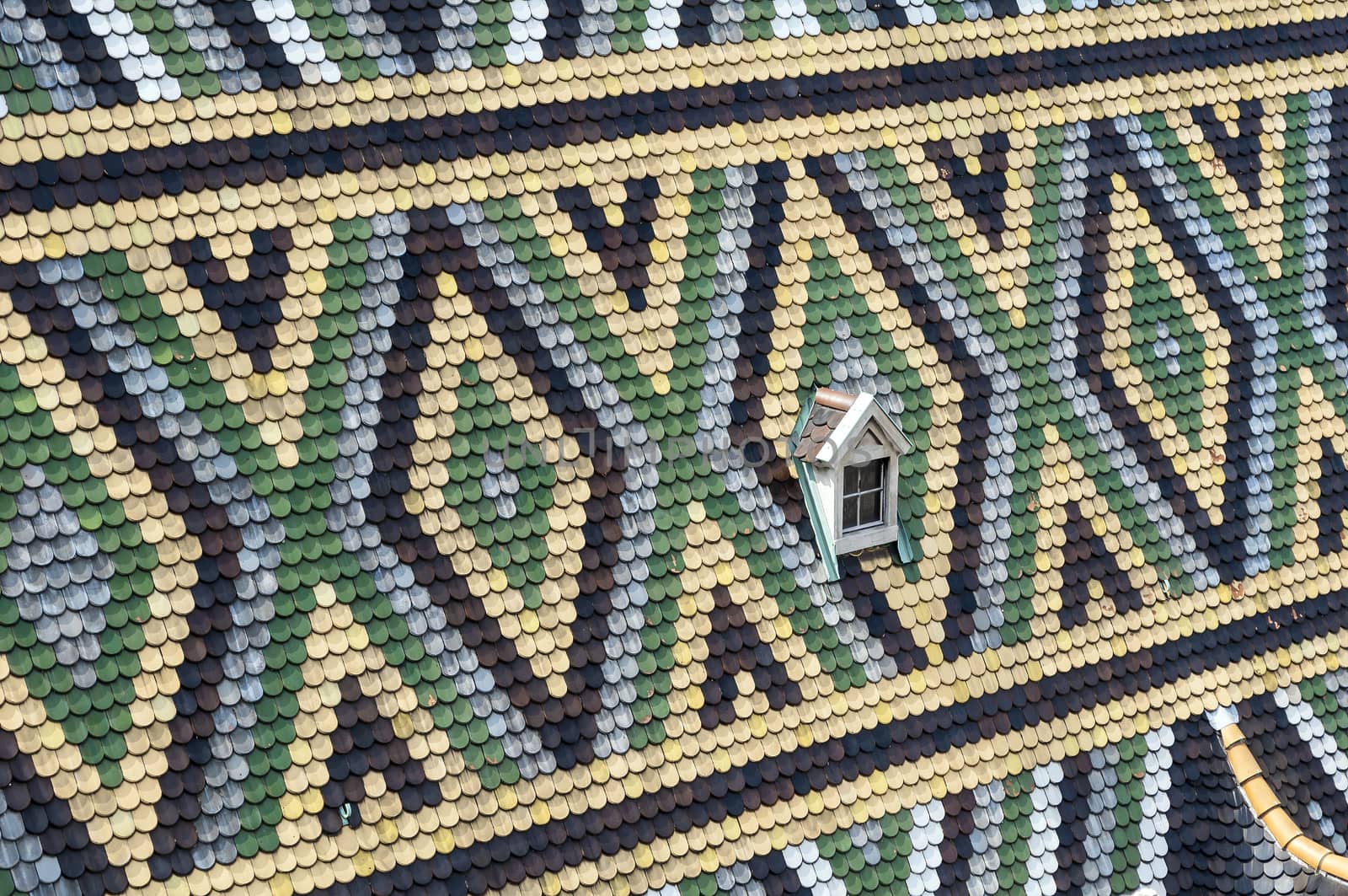 Detailed view of colorful wooden roof shingles.