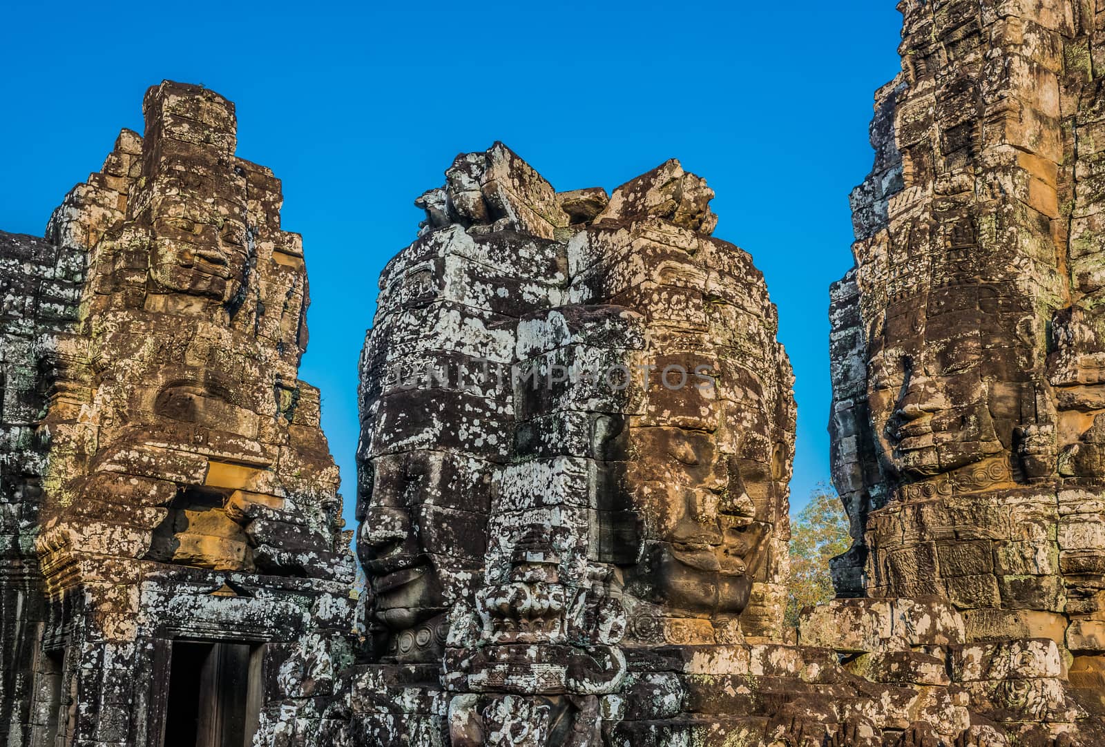 giant faces prasat bayon temple angkor thom cambodia by PIXSTILL