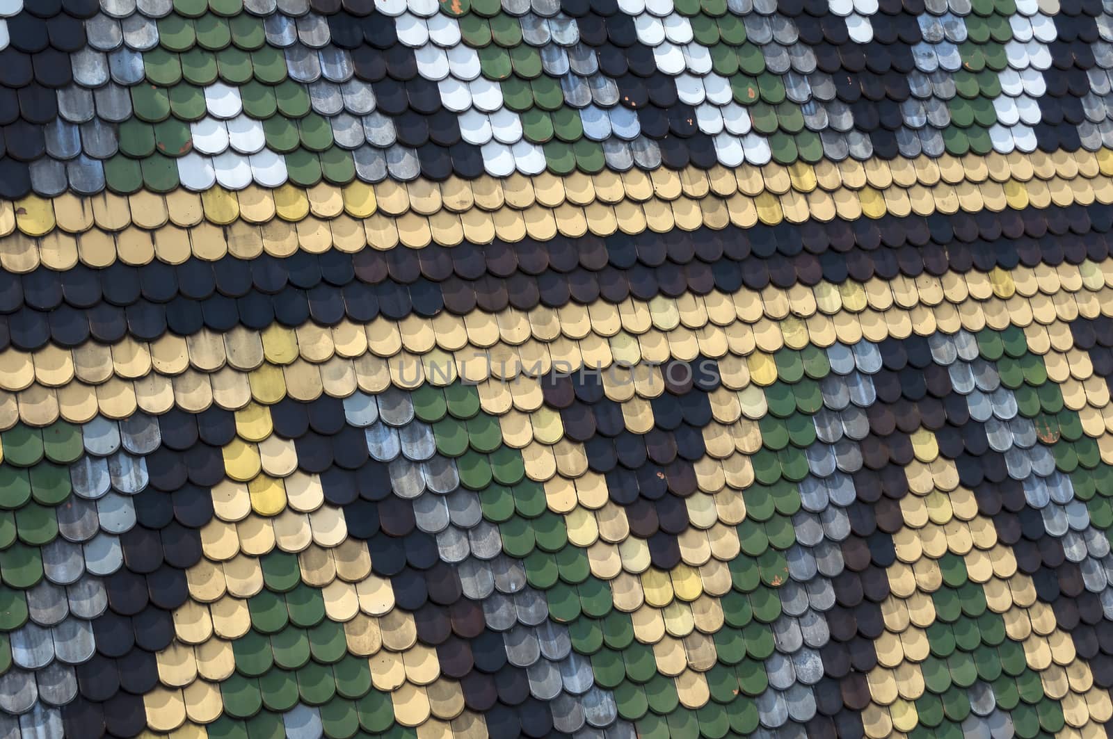 Detailed view of colorful wooden roof shingles.