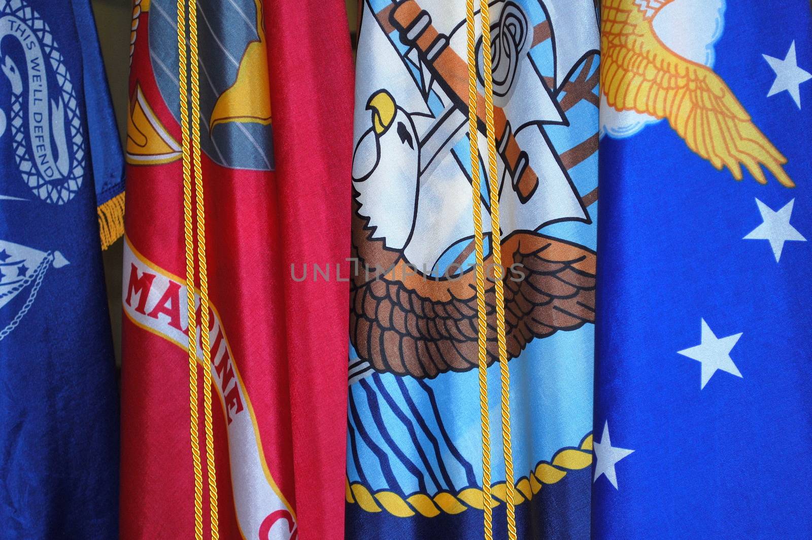 Military flags displayed indoors.