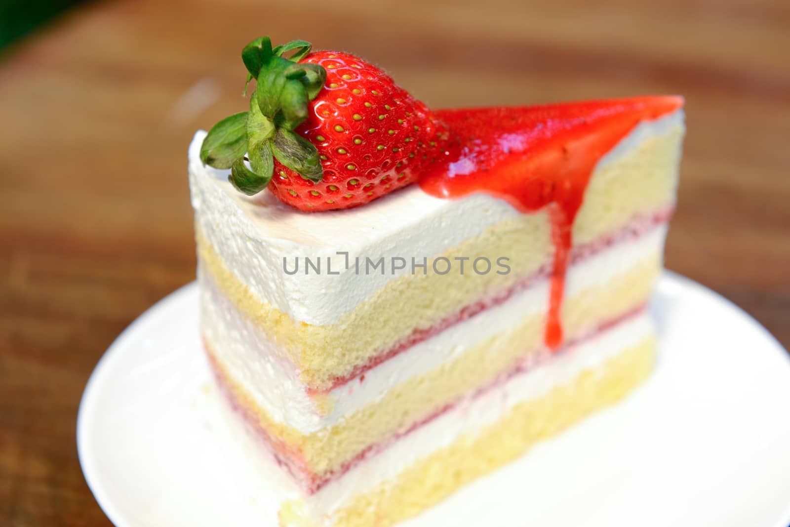 Strawberry cake on a white dish