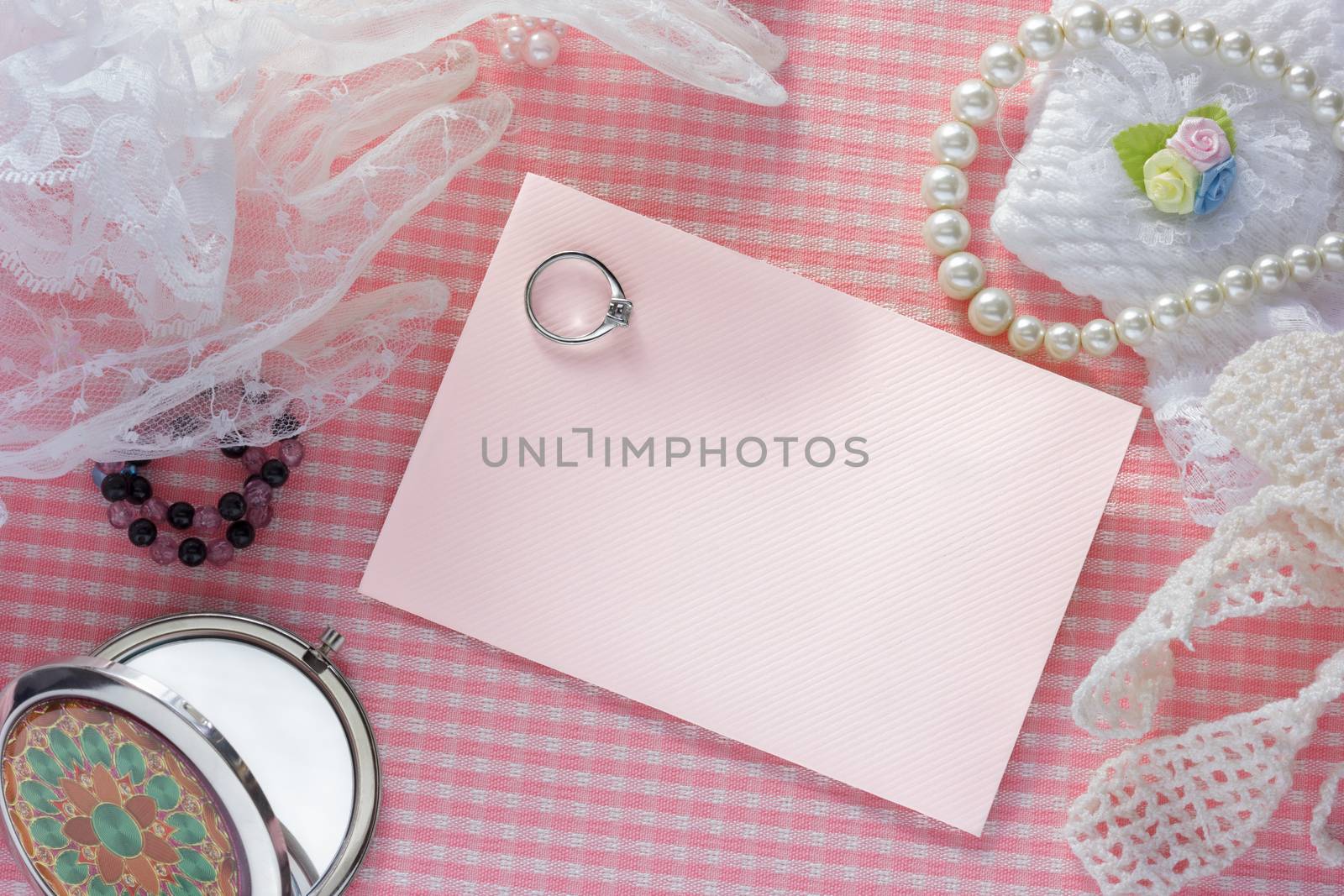 blank pink card for congratulations with  ring.