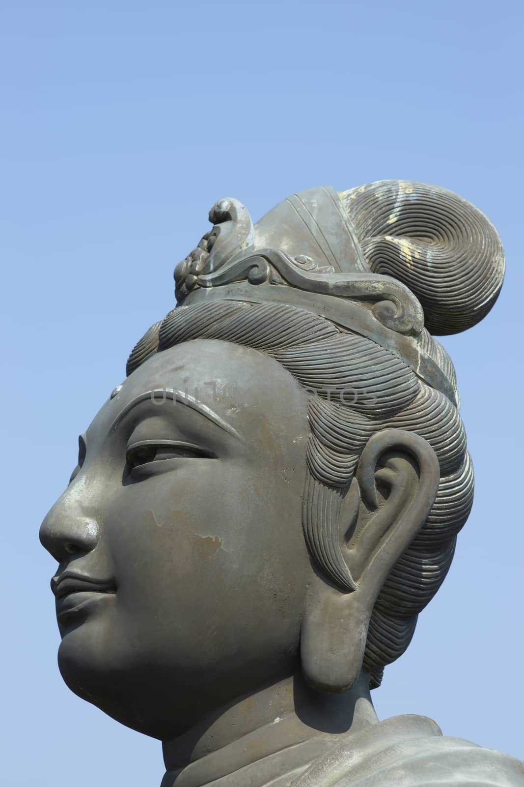 Head of a Buddha statue at Po Lin Buddhist Monastery located on Ngong Ping Plateau on Lantau Island, Hong Kong, China
