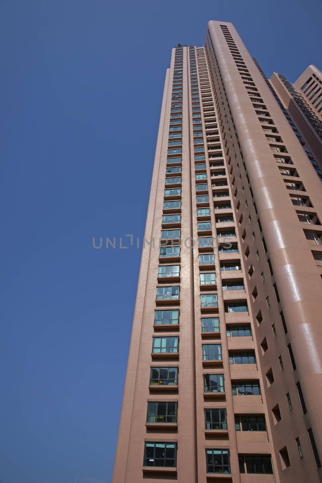 Tall residential tower block in the city of Hong Kong, China