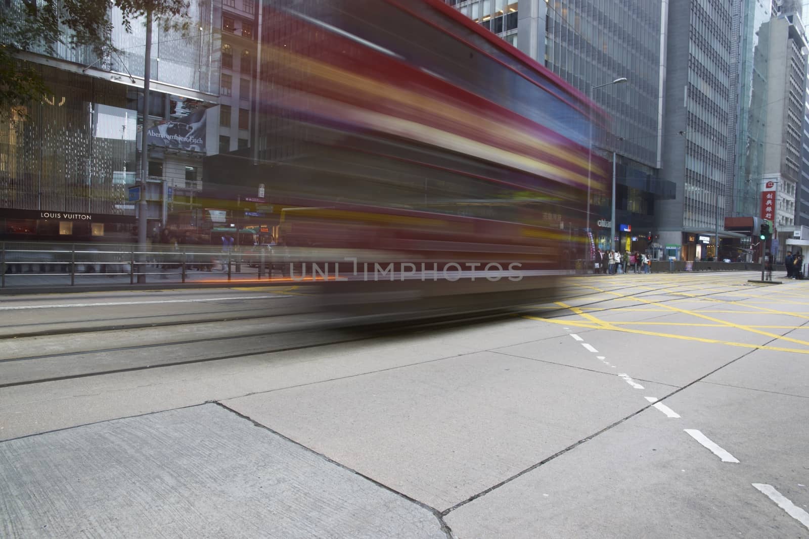 Tram crossing a road junction on Hong Kong Island in Hong Kong
