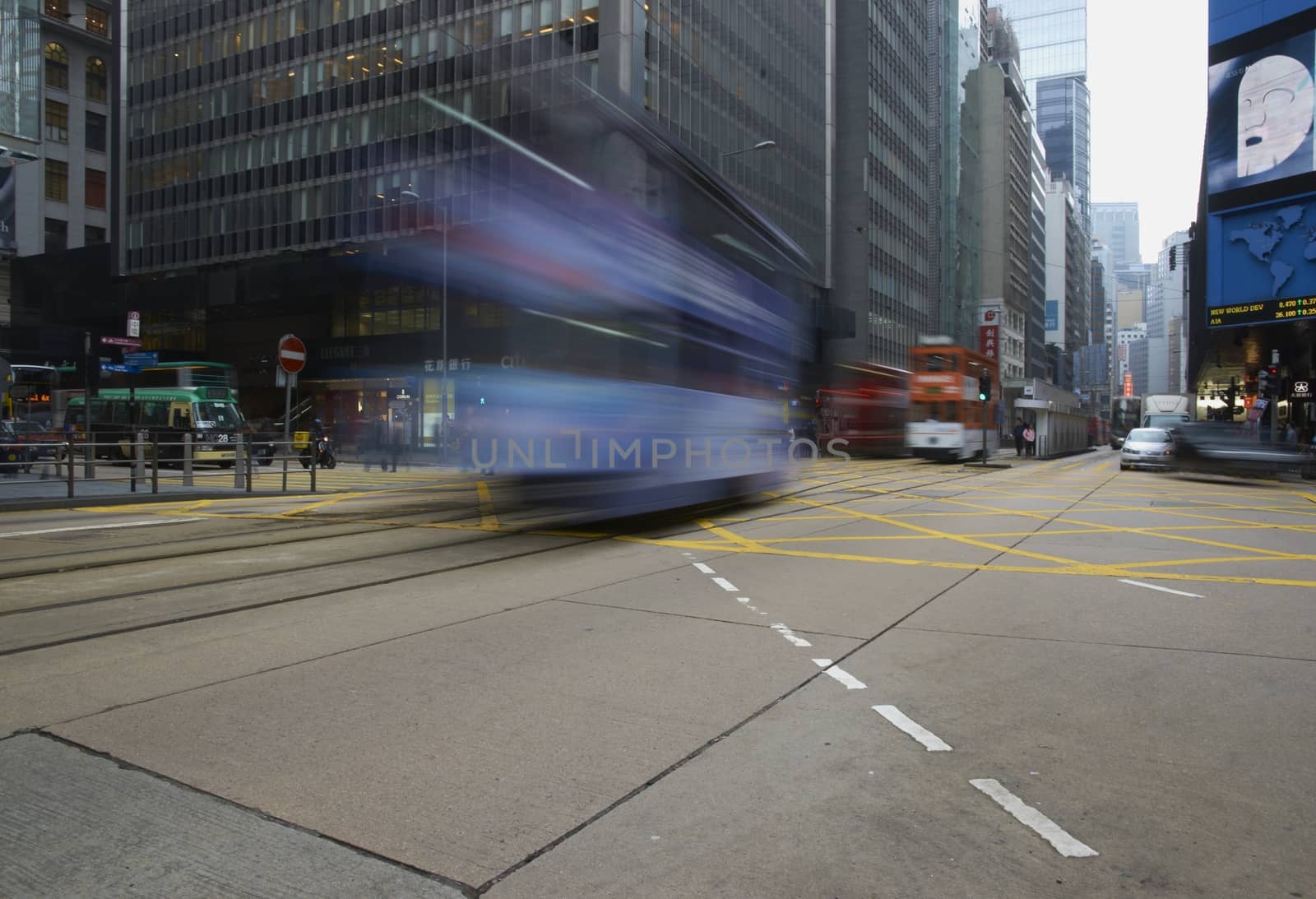 Tram crossing a road junction on Hong Kong Island in Hong Kong