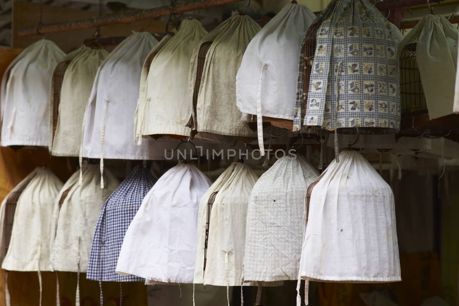 Covered bird cages in the Yuen Po Street Bird Garden in Kowloon, Hong Kong.
