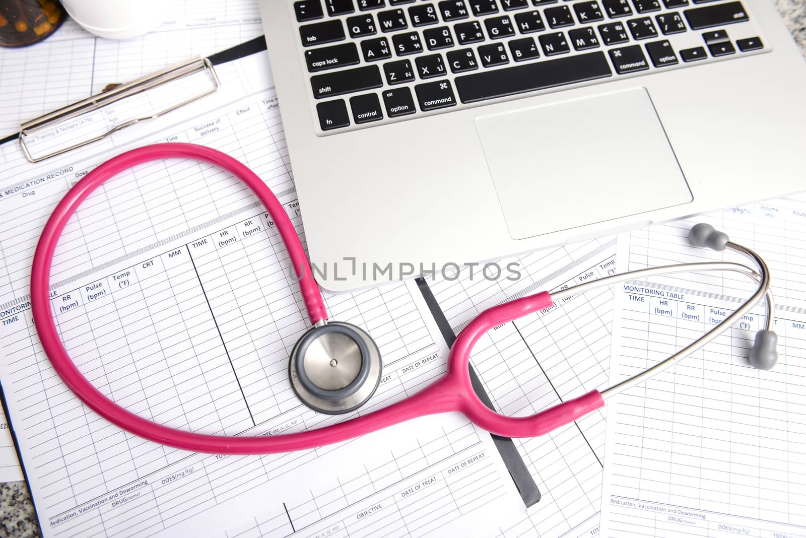 stethoscope and labtop and other medical object on the table