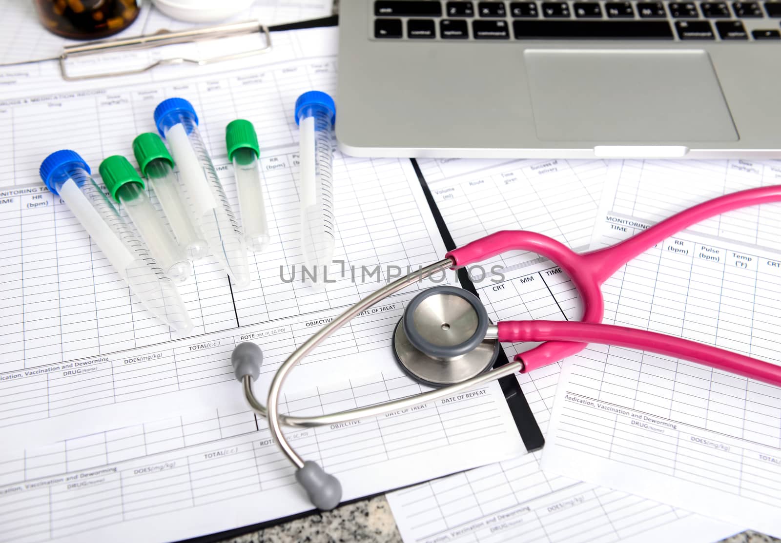 stethoscope and labtop and other medical object on the table