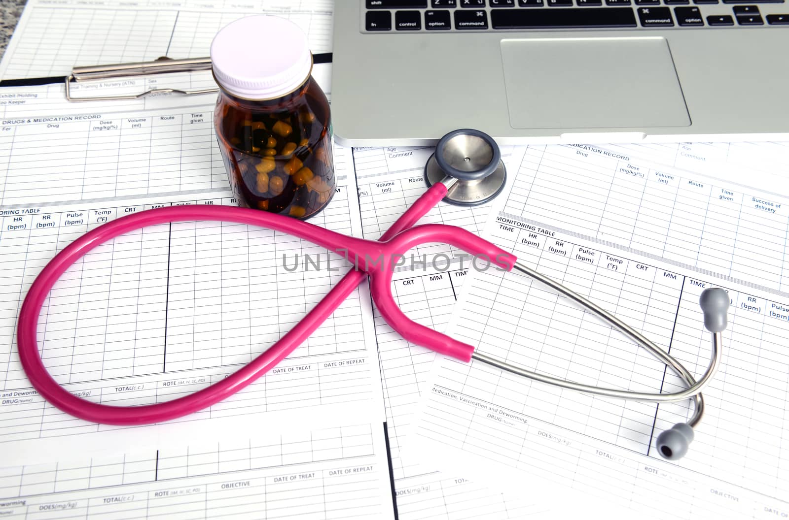 stethoscope and labtop and other medical object on the table