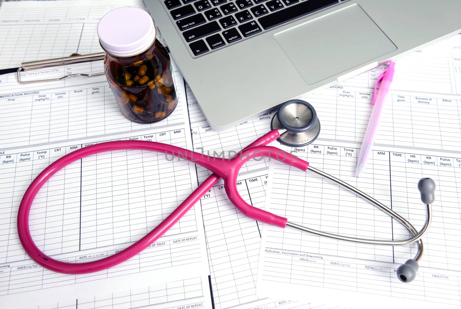 stethoscope and labtop and other medical object on the table