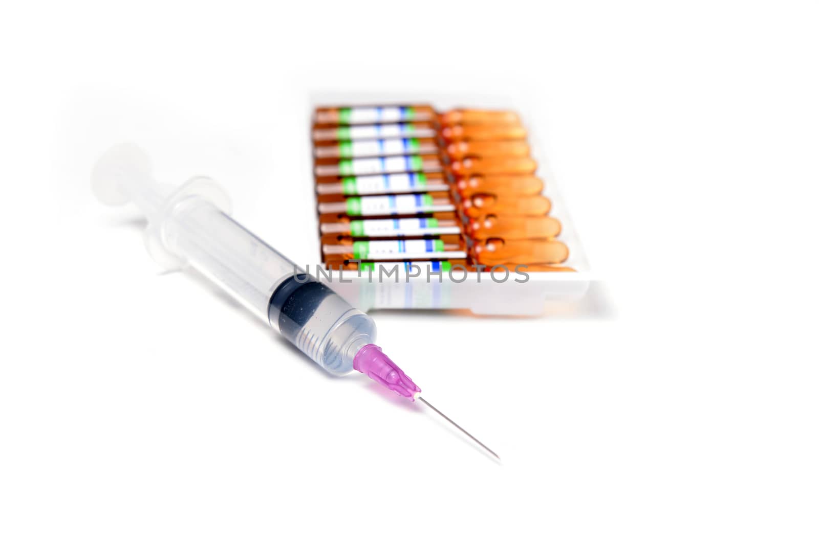 ampule and syringe and on white table