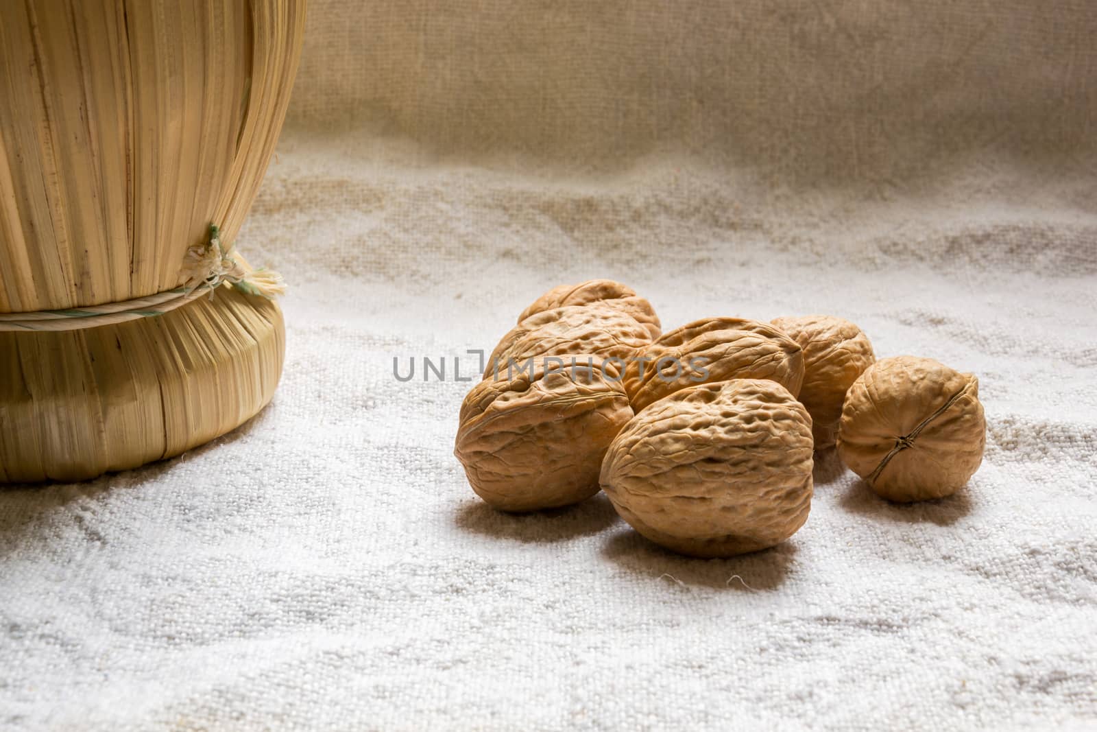 Set with some walnuts and a wine bottle by enrico.lapponi
