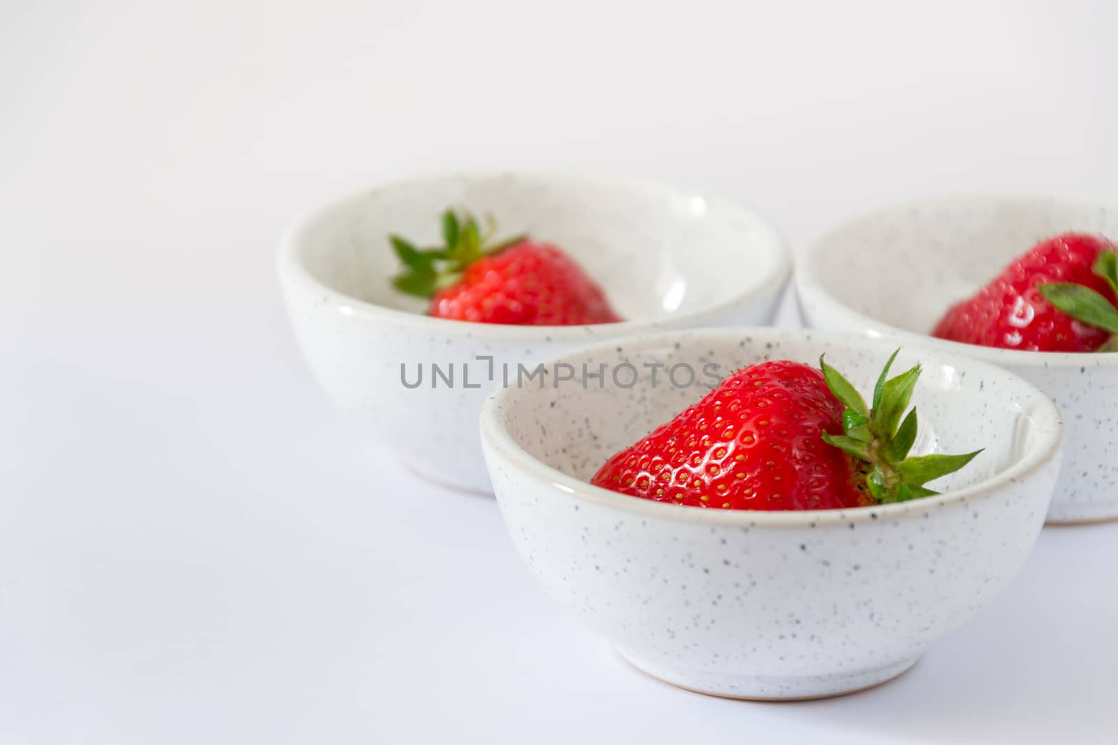 set of three ceramic bowls with strawberries