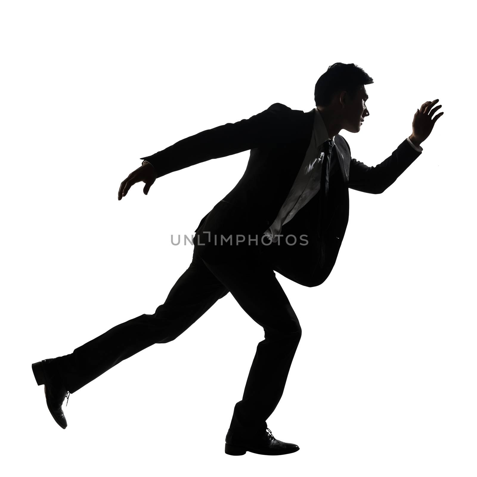 Silhouette of Asian business man running, full length portrait isolated on white. Side view.