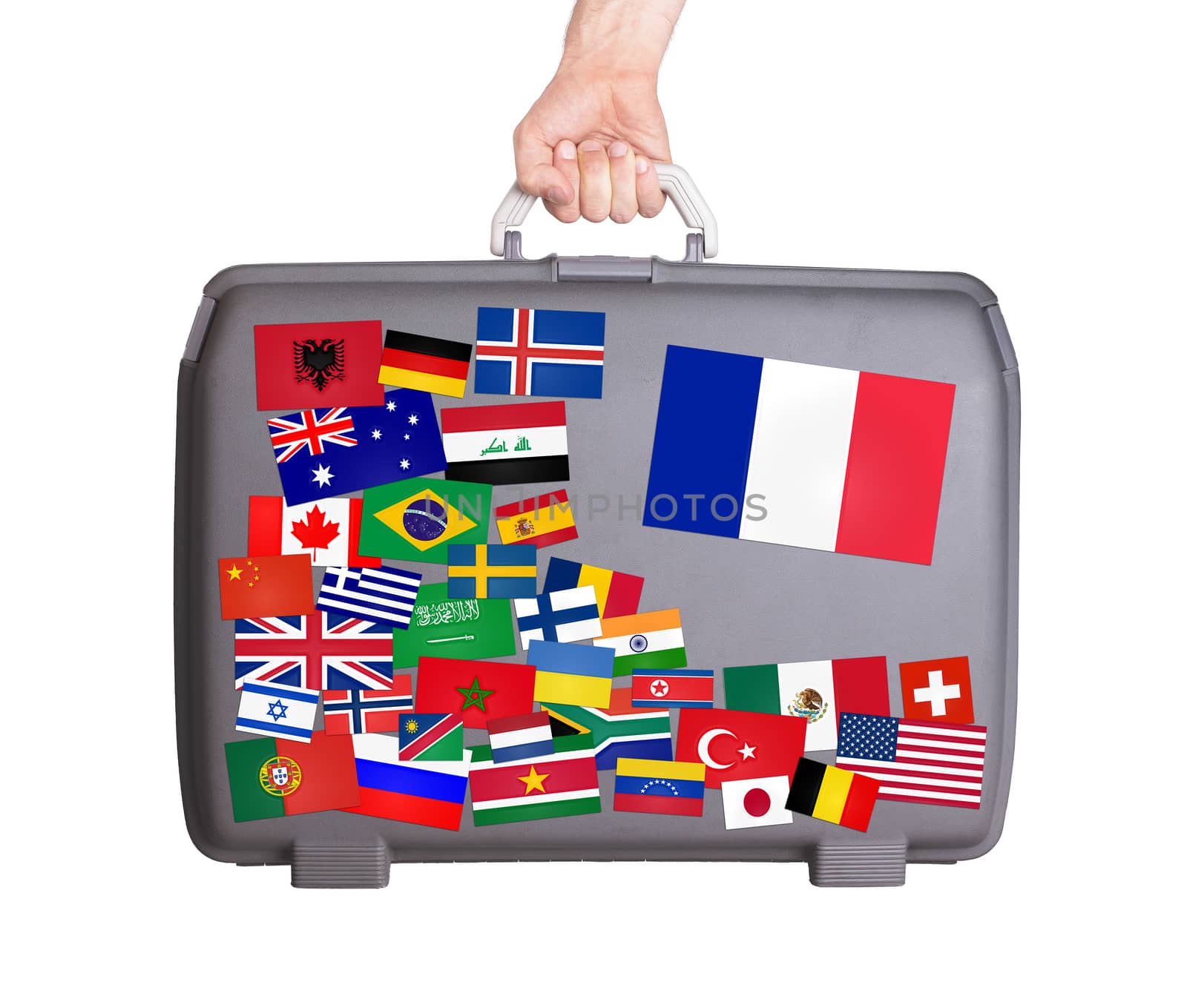 Used plastic suitcase with lots of small stickers, large sticker of France