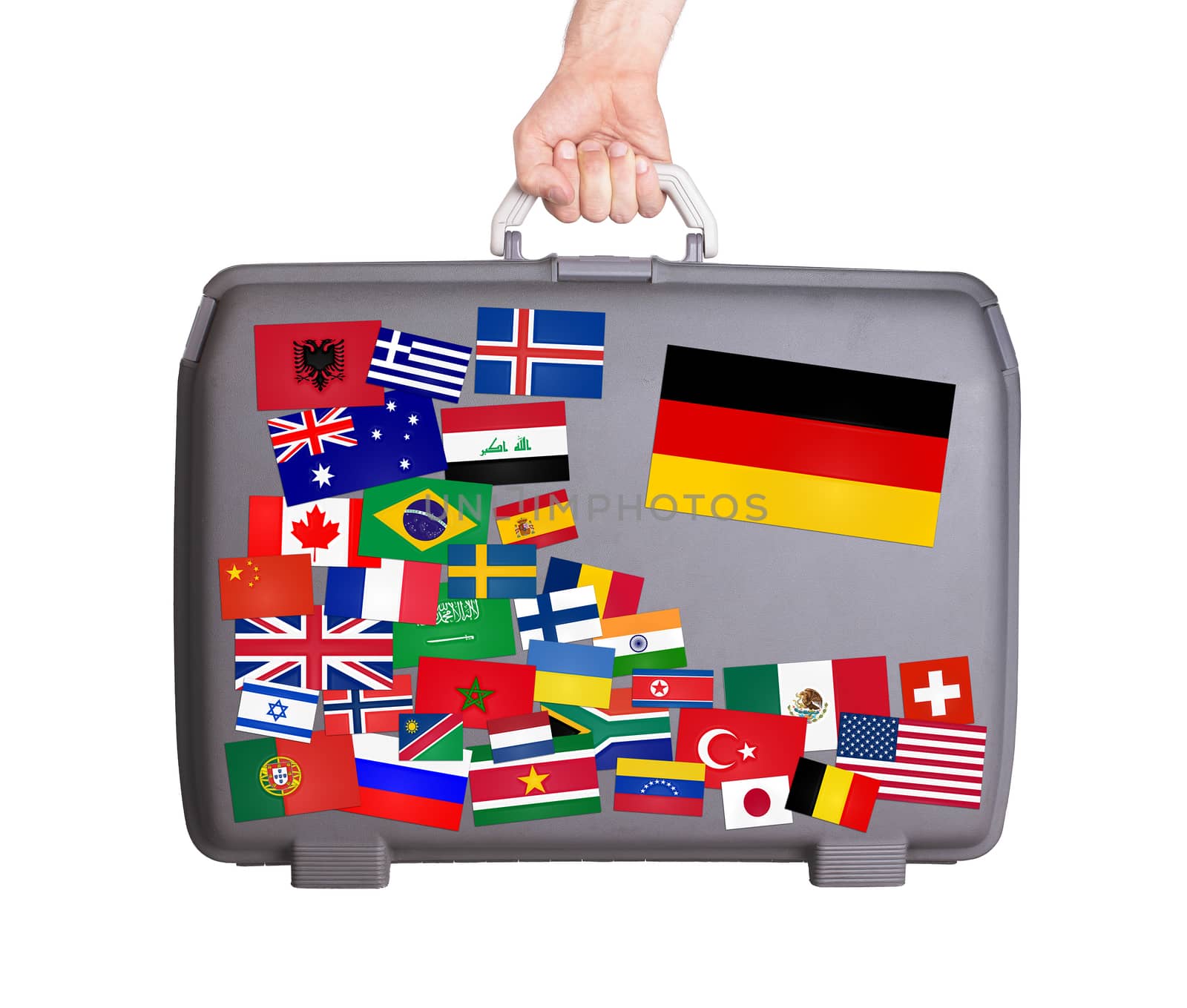 Used plastic suitcase with lots of small stickers, large sticker of Germany