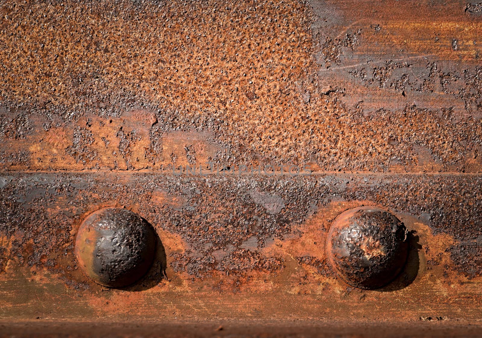 background or texture two rusty iron rivets