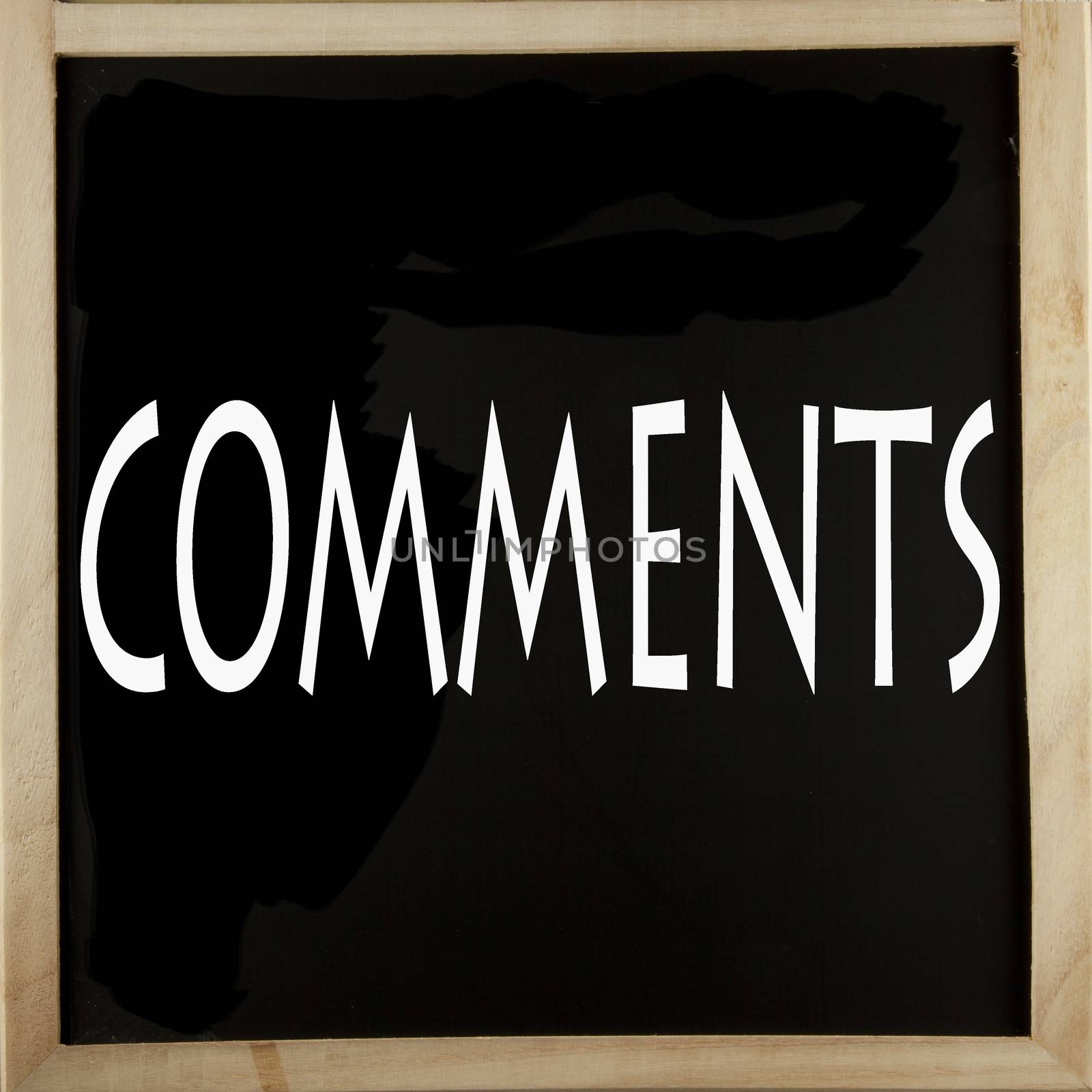 Word "Comments" written with chalk over a blackboard