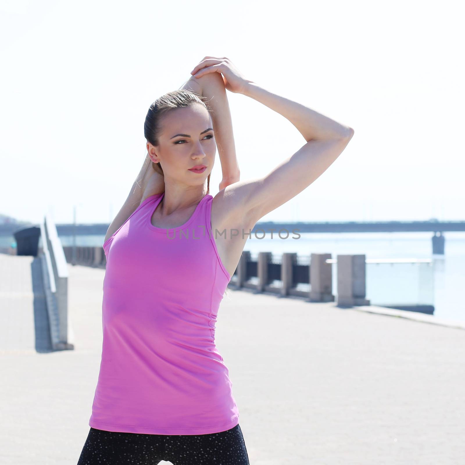 Sport, activity. Cute woman during warm-up