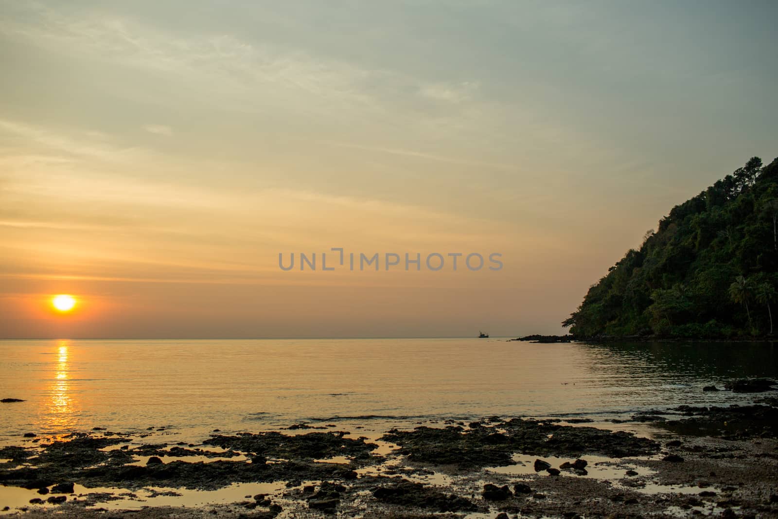 The large blue sky and seascape.