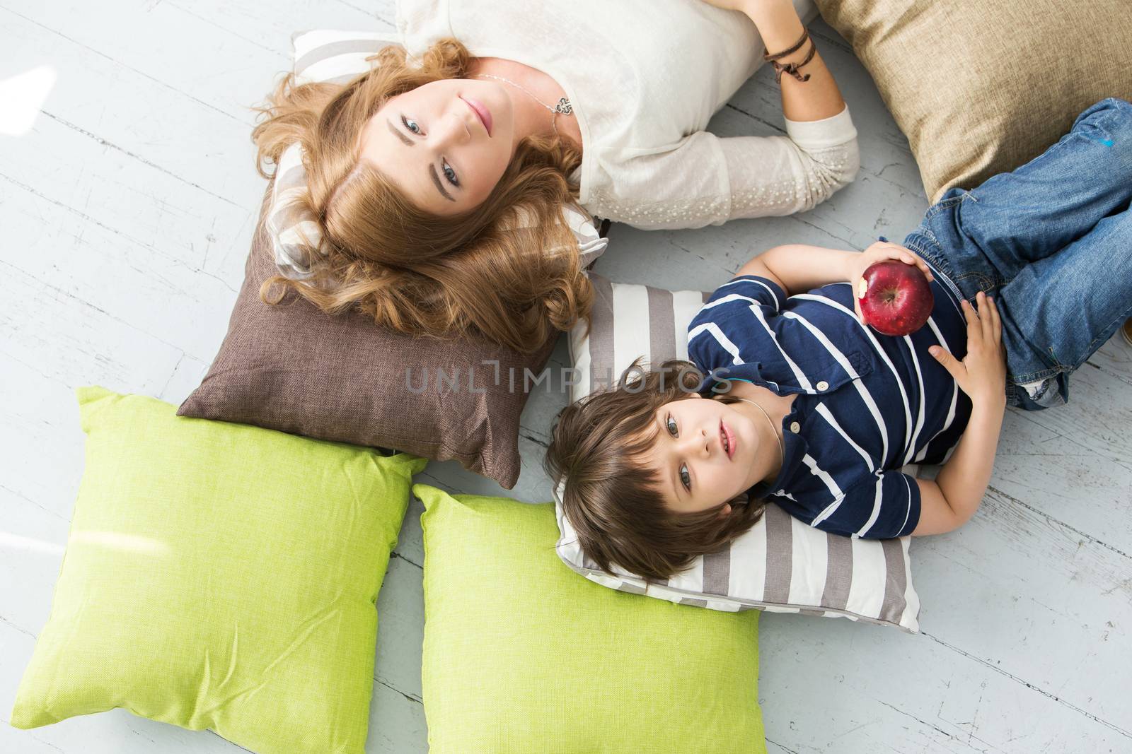 Cute, adorable boy with mother on the floor