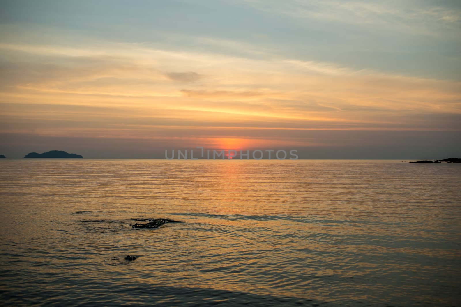 The large blue sky and seascape.