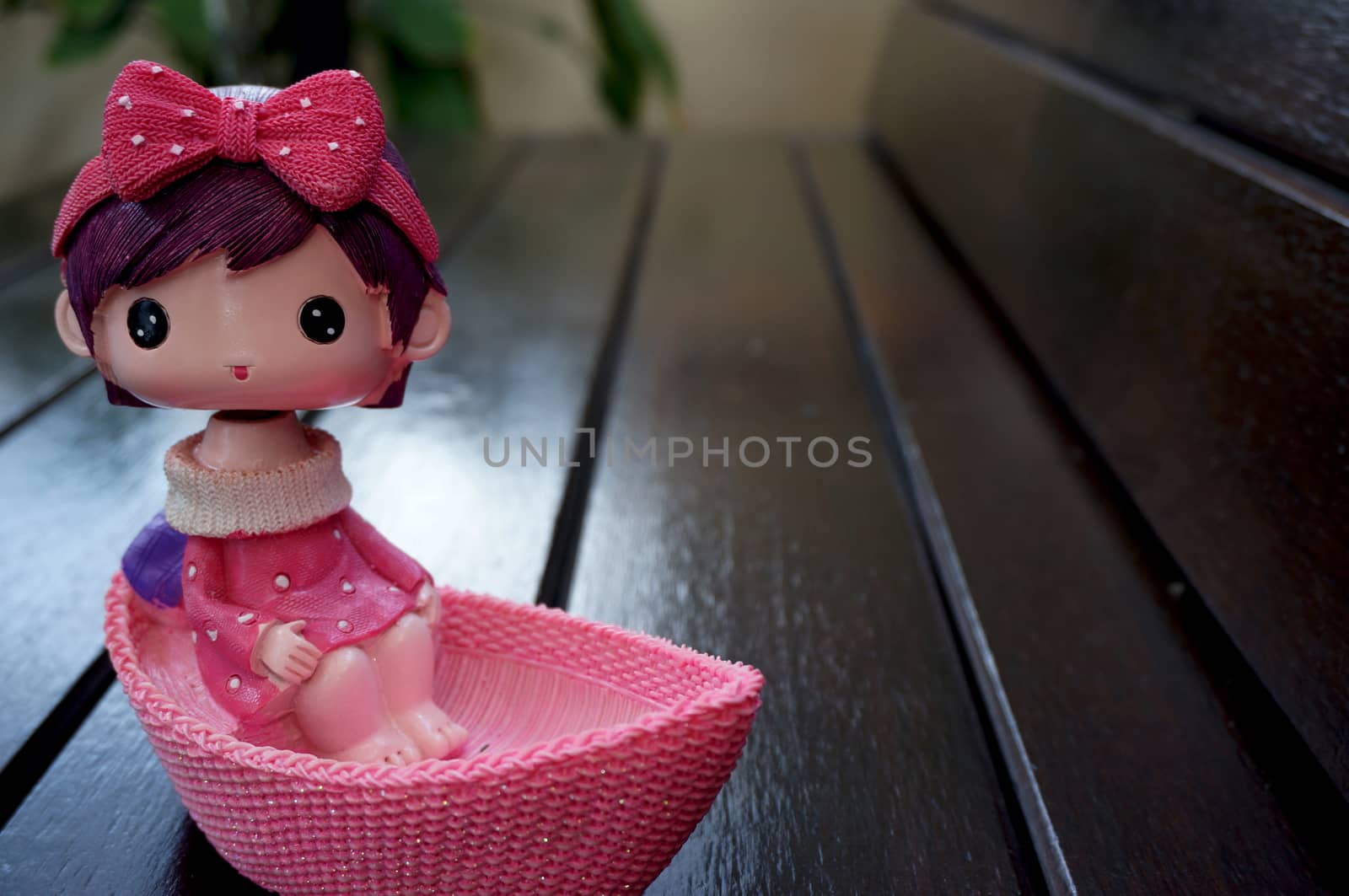 Doll on wooden chair by ninun