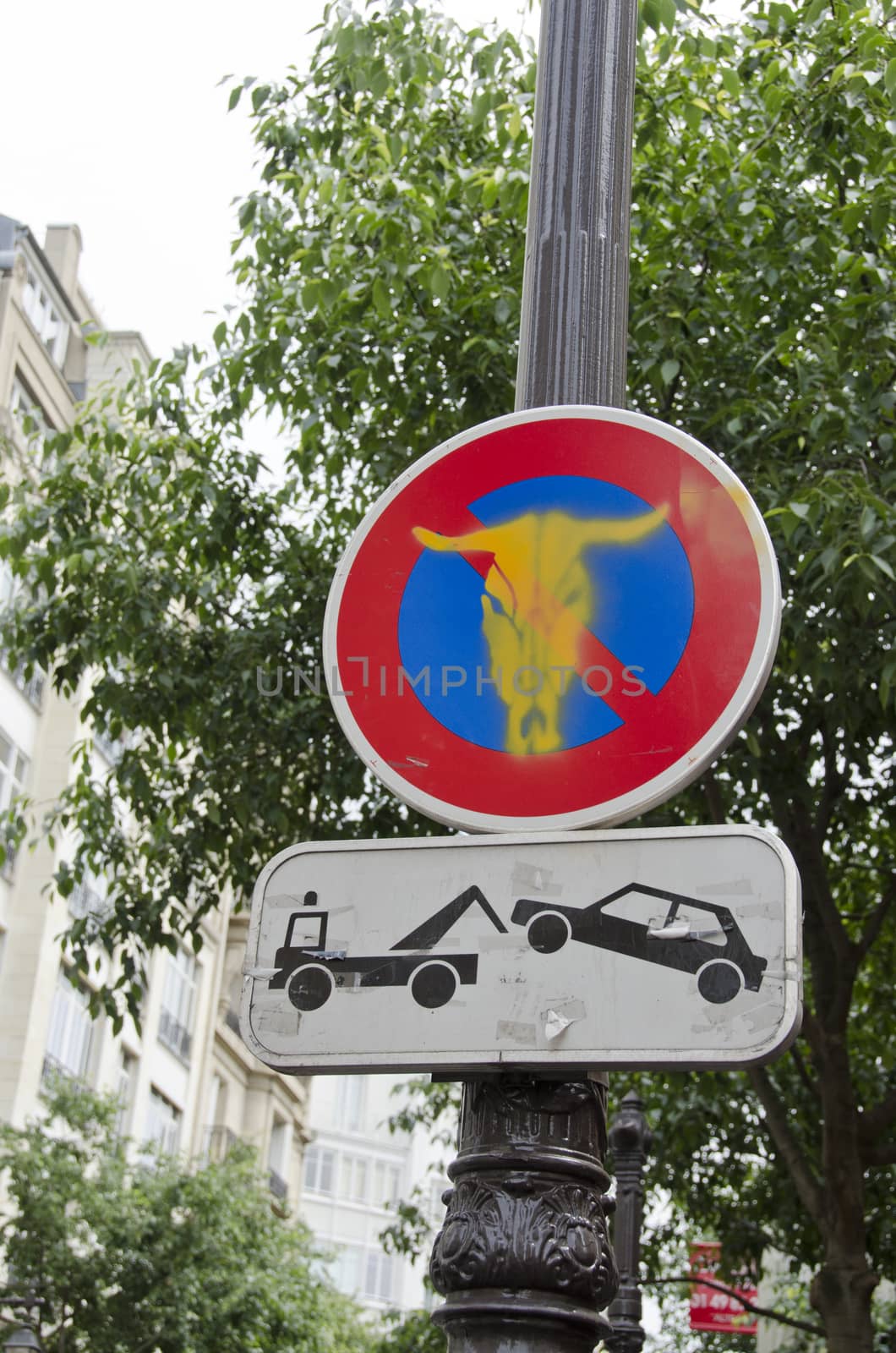 road sign in Paris street on lamp post