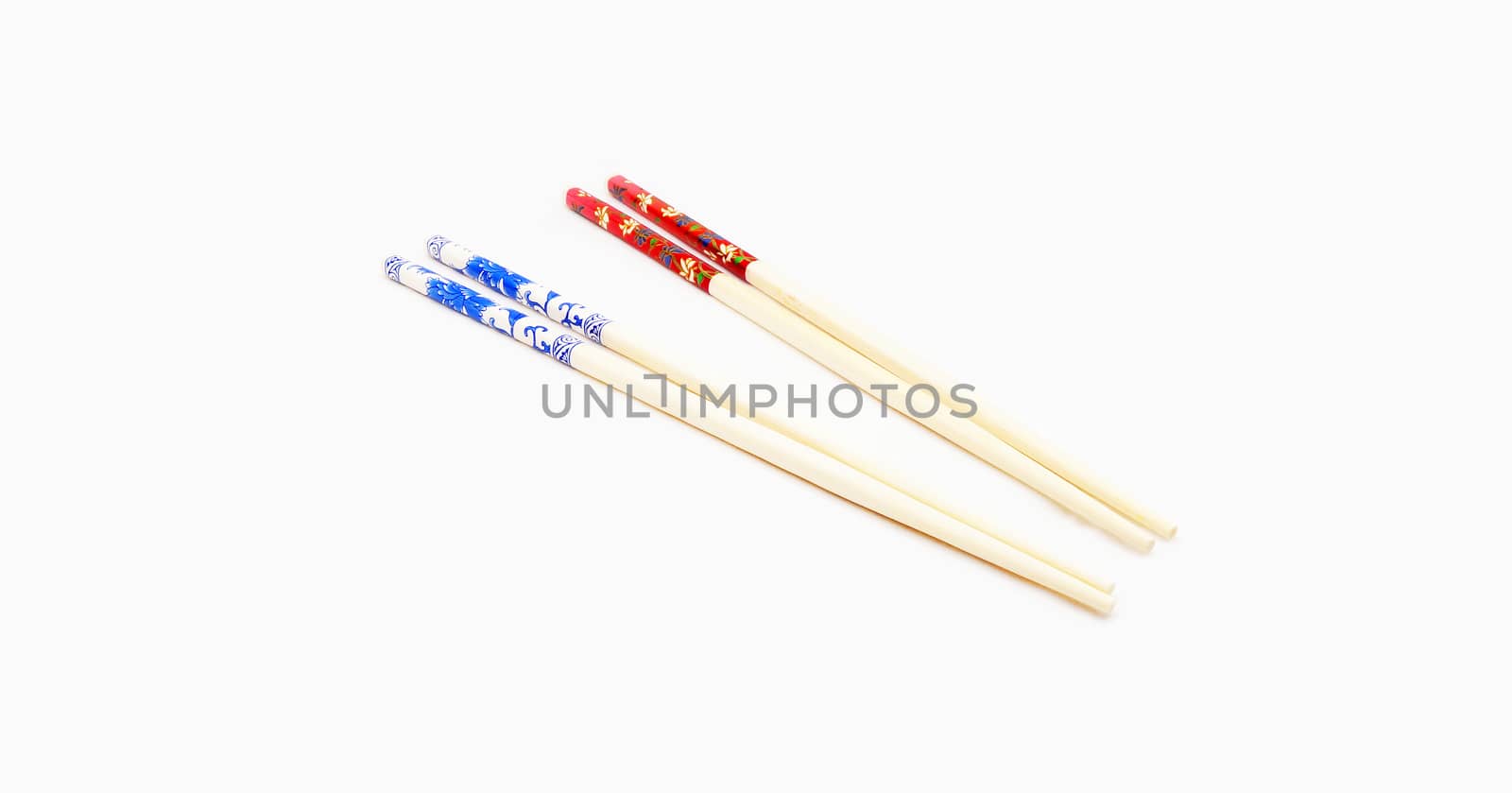 Two pairs of chopsticks put together, have two colors are red and blue.                               