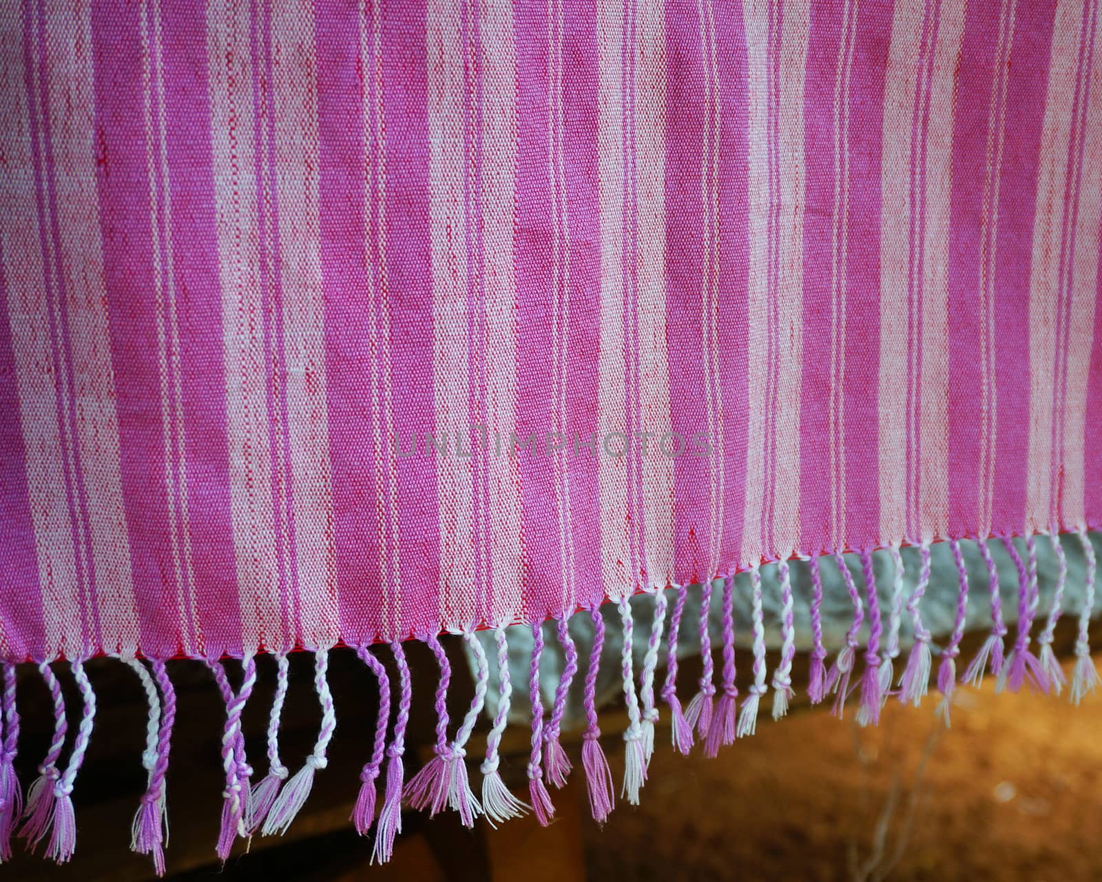 Purple and white yarn woven into large pieces, waving a towel with a beautiful view.                              