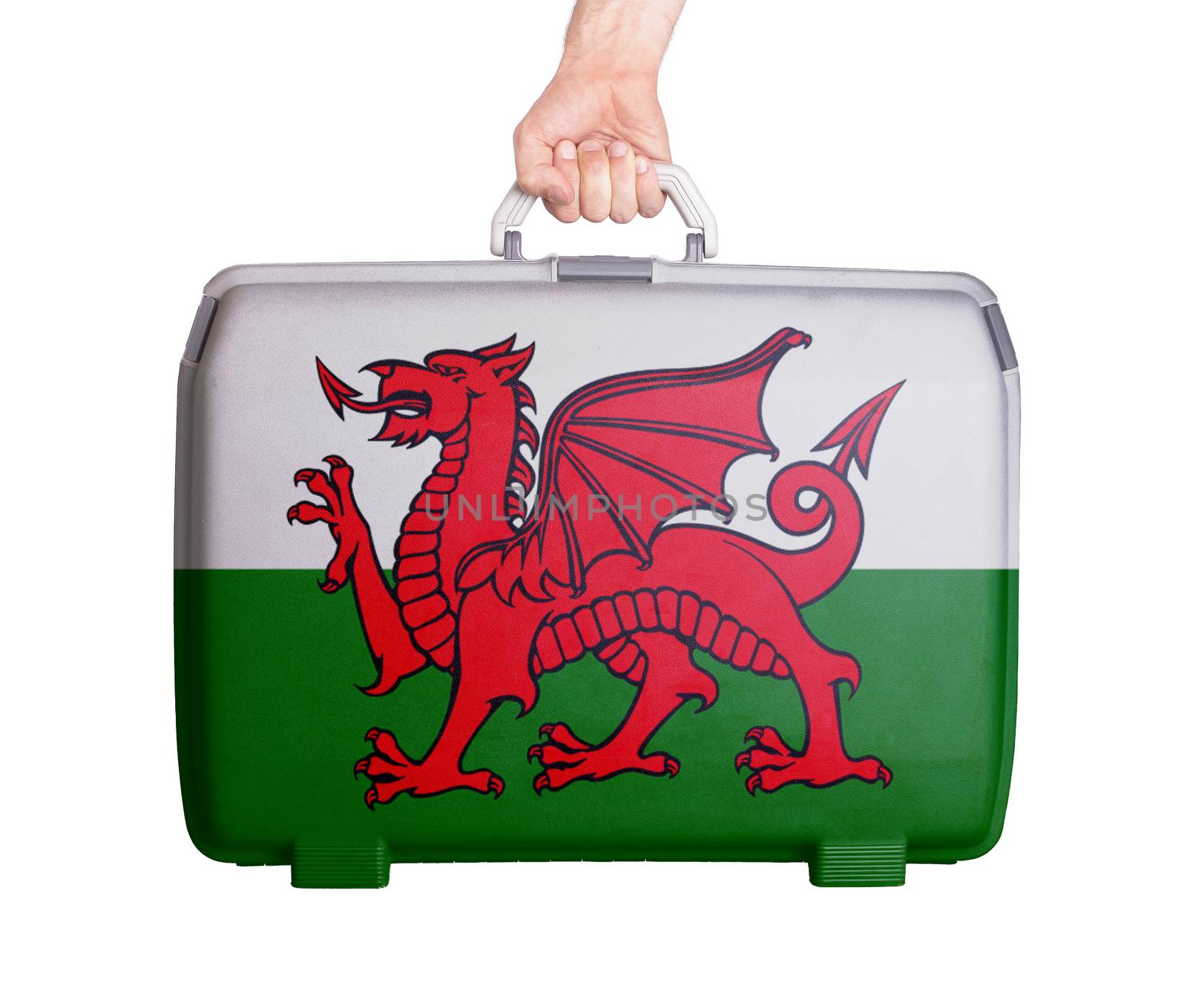Used plastic suitcase with stains and scratches, printed with flag, Wales