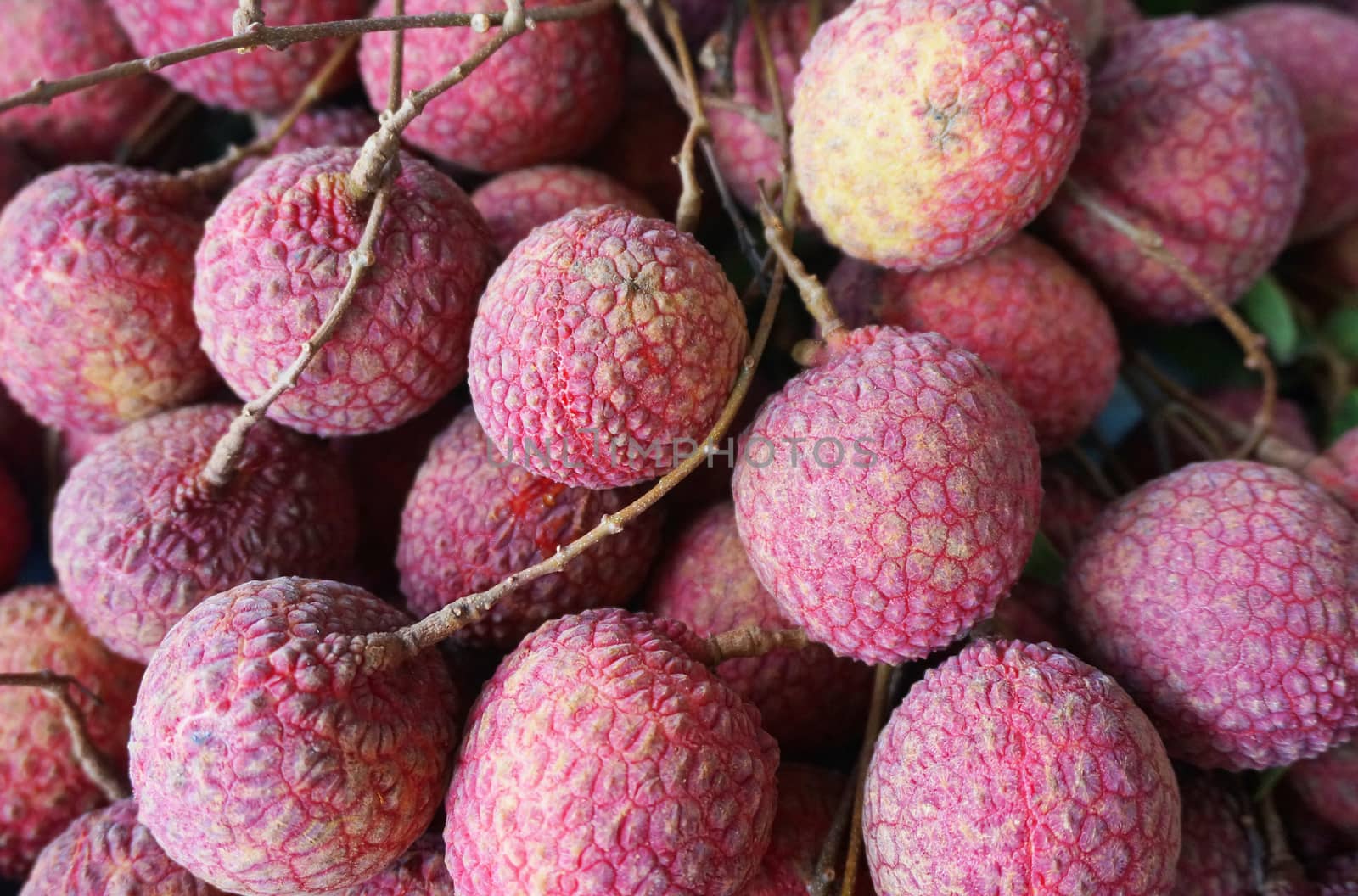 Big red ripe lychee, putting together as a bunch  and it appetizing Delicious.                              