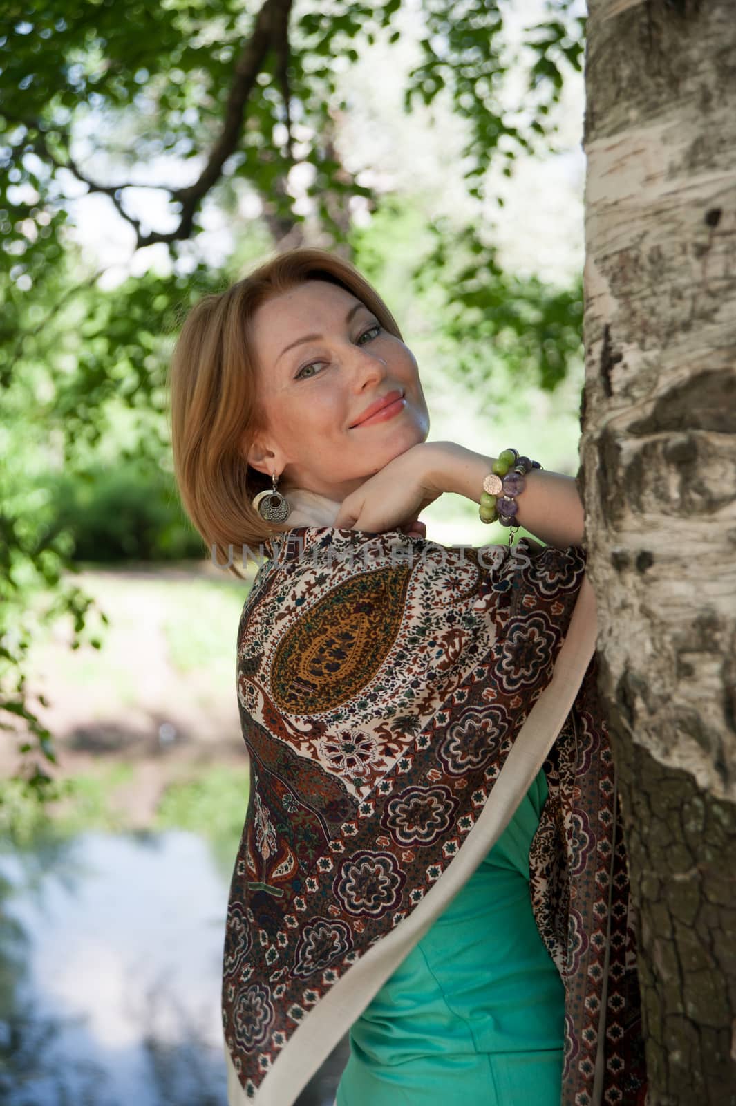 beautiful woman in birch summer in the Park for a walk