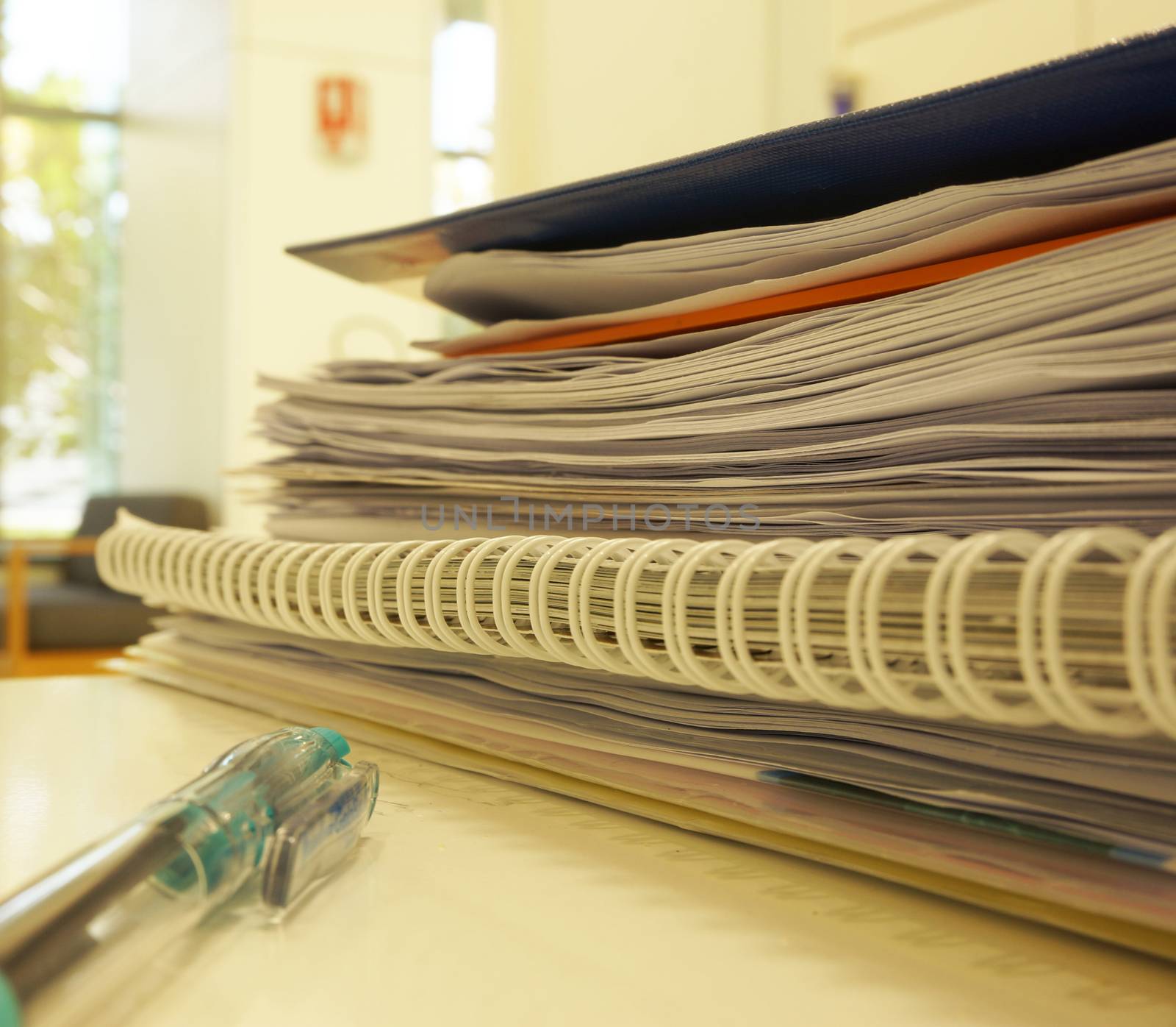 stack of documents in office desk  by ninun