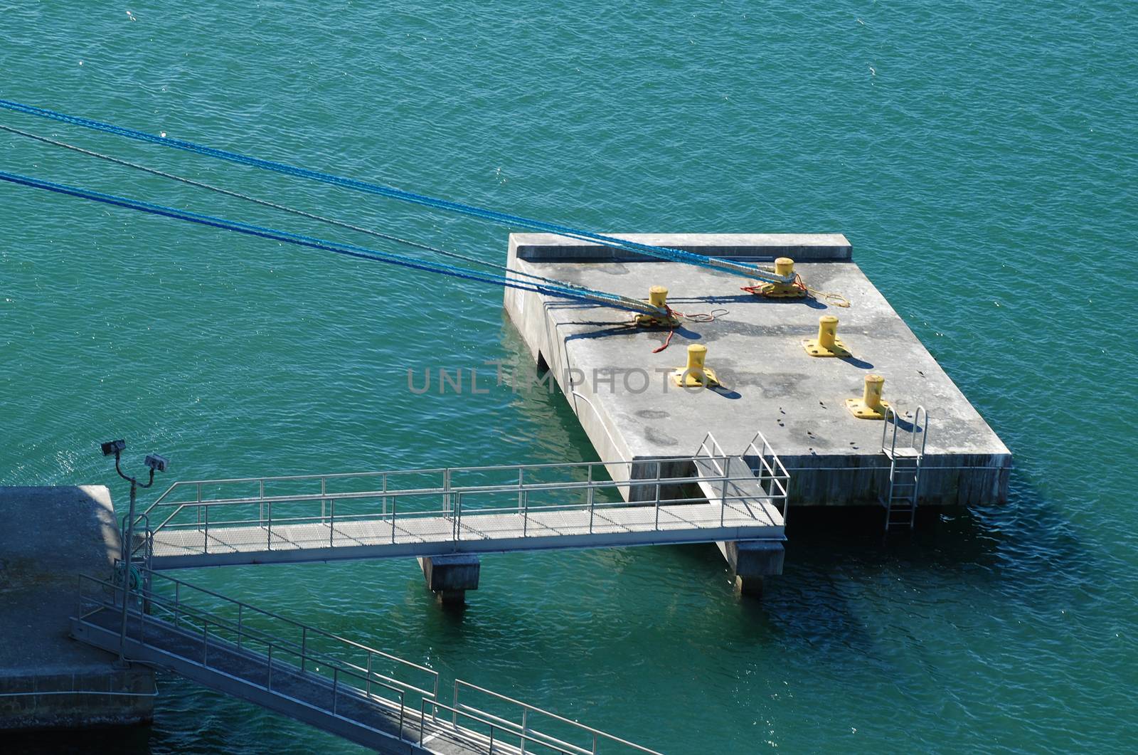 stock picture of ship ropes and structures to mooring the ship on the dock