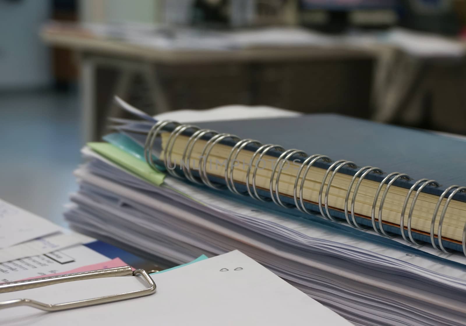 On the desk, have many documents, both financial reports and results of operations.                               