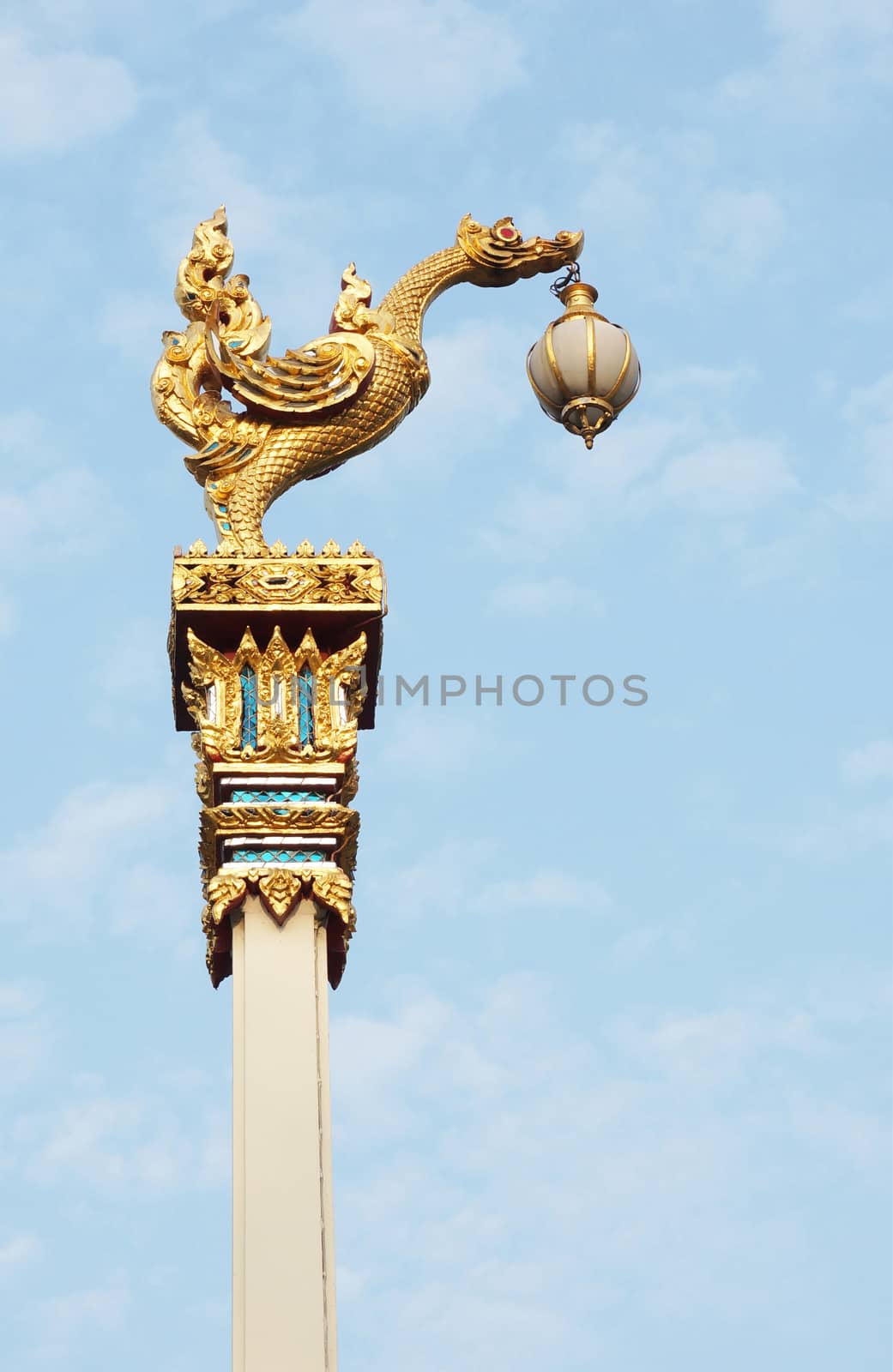 The bird lamp on high pillar, it is at the Thai temple, in Thailand                   