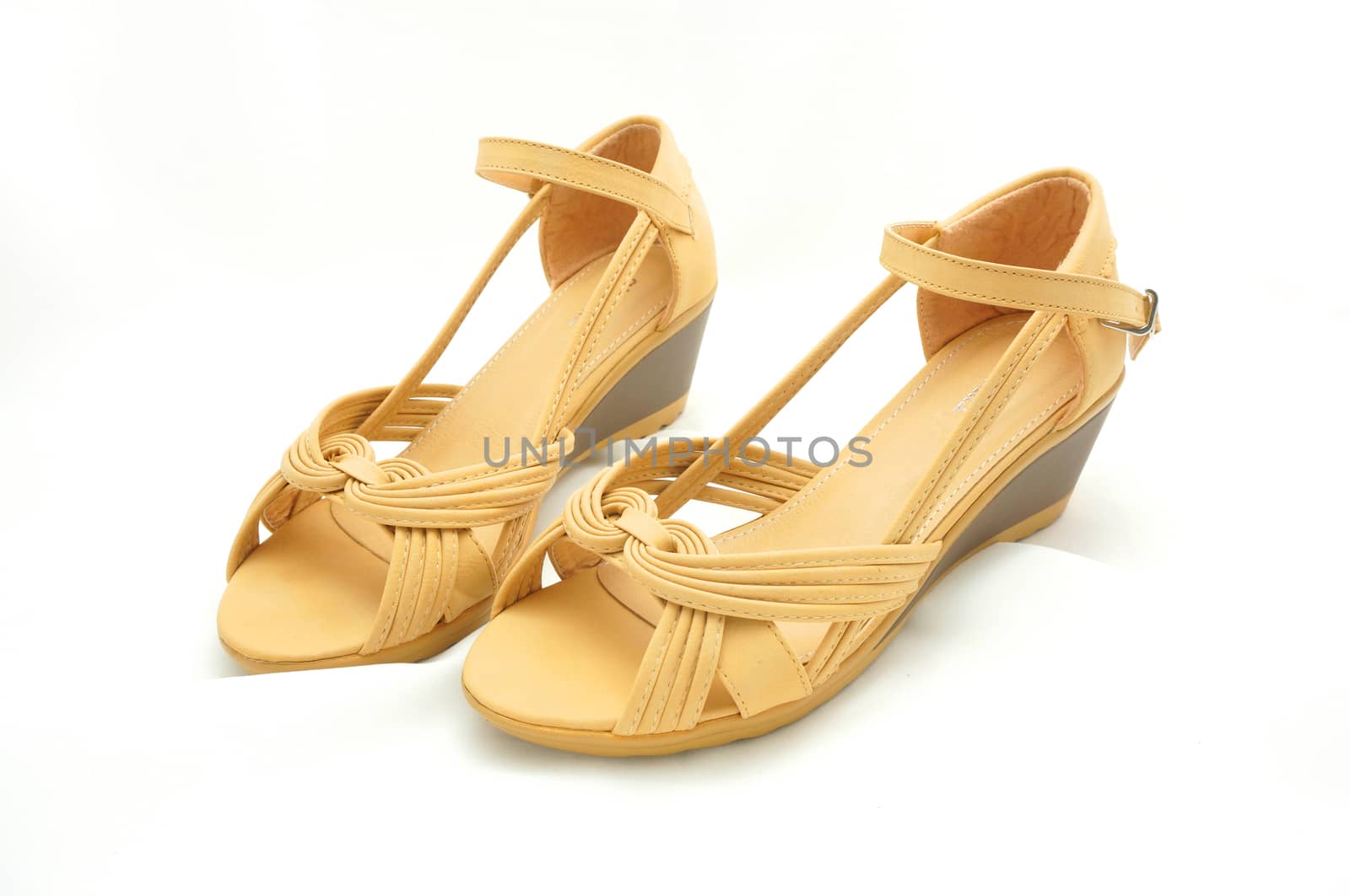 Brown shoes for women, slightly elevated heel , open front, side weave pattern.                              