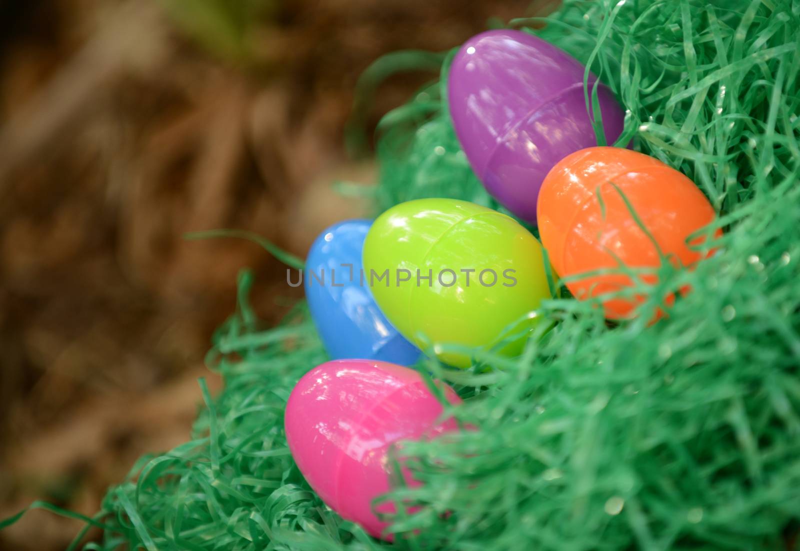 plastic easter eggs in fake green grass